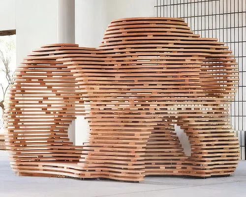 This CNC-routed plywood installation is basically a Japanese porch having a glow-up in public