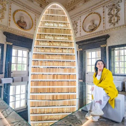 Es Devlin just put a spinning, glowing bookshelf inside an 18th-century temple and honestly same