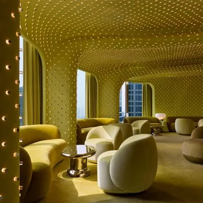 This lime-green cocktail bar on the 38th floor of a Zaha Hadid building has 20,000 tiny lights and we are not okay