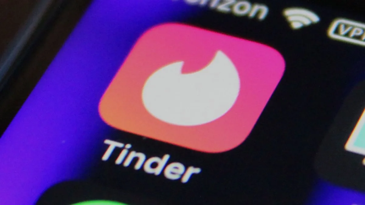 Tinder's parent company is slowing hiring to fund its AI push